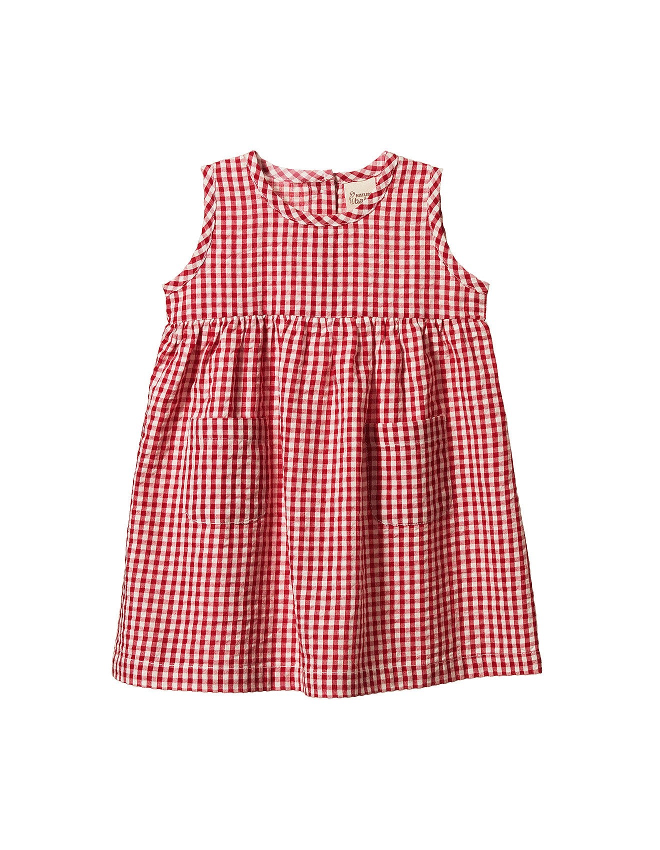 Nature Baby Dorothy Dress in red gingham, a lightweight organic cotton baby dress with a sleeveless design, gathered waist and patch pockets.