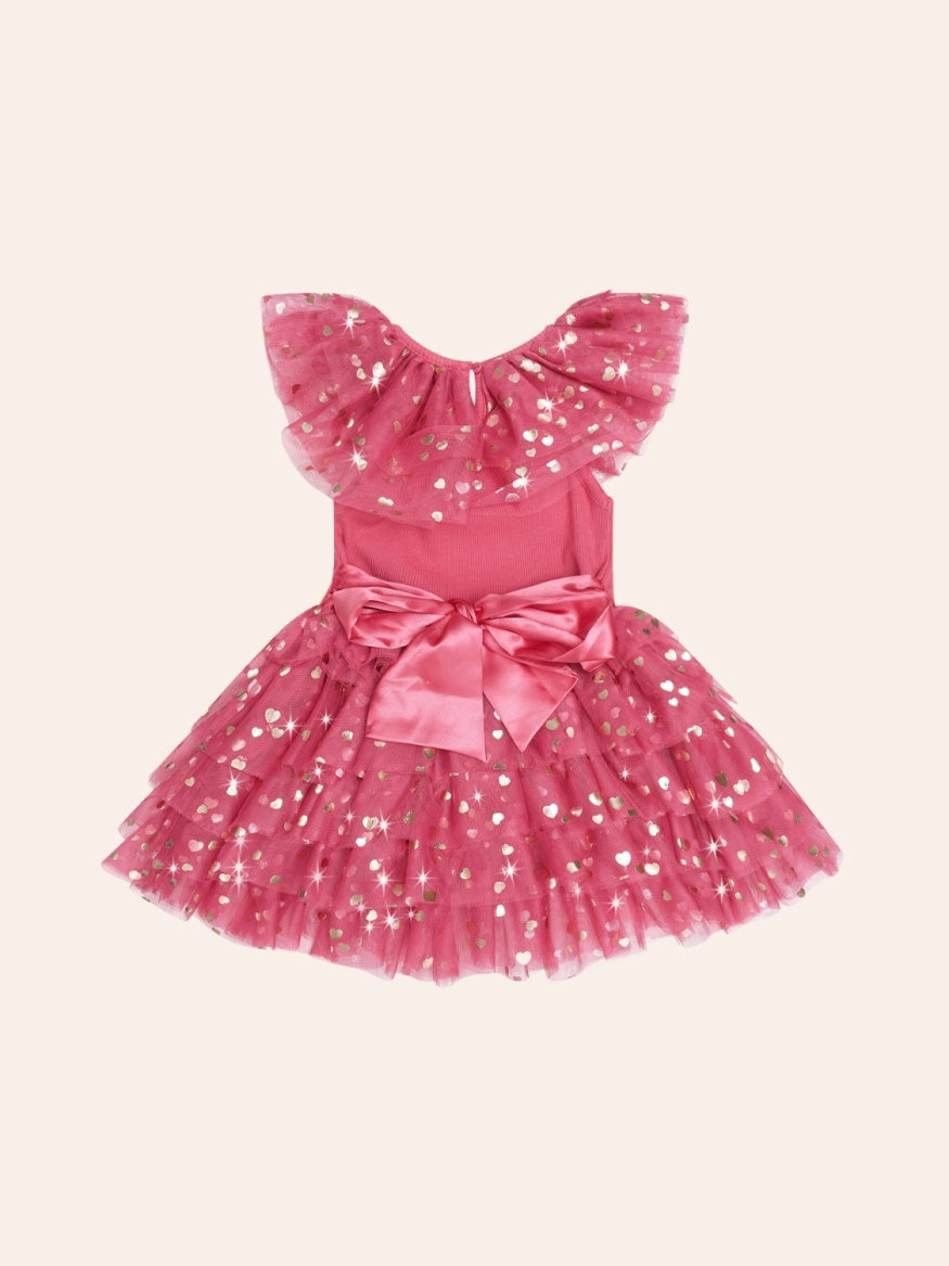 Back view Huxbaby festive heart bow tiered tulle dress featuring a soft tulle skirt, layered tiers, heart detailing, and a decorative bow for a whimsical children’s occasion outfit.
