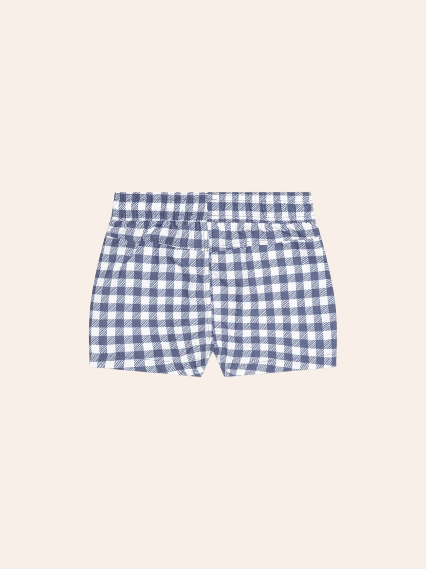 Back view of Huxbaby Ink Gingham Boardshorts featuring a classic gingham pattern, lightweight quick-drying fabric, and comfortable kids’ swimwear design.