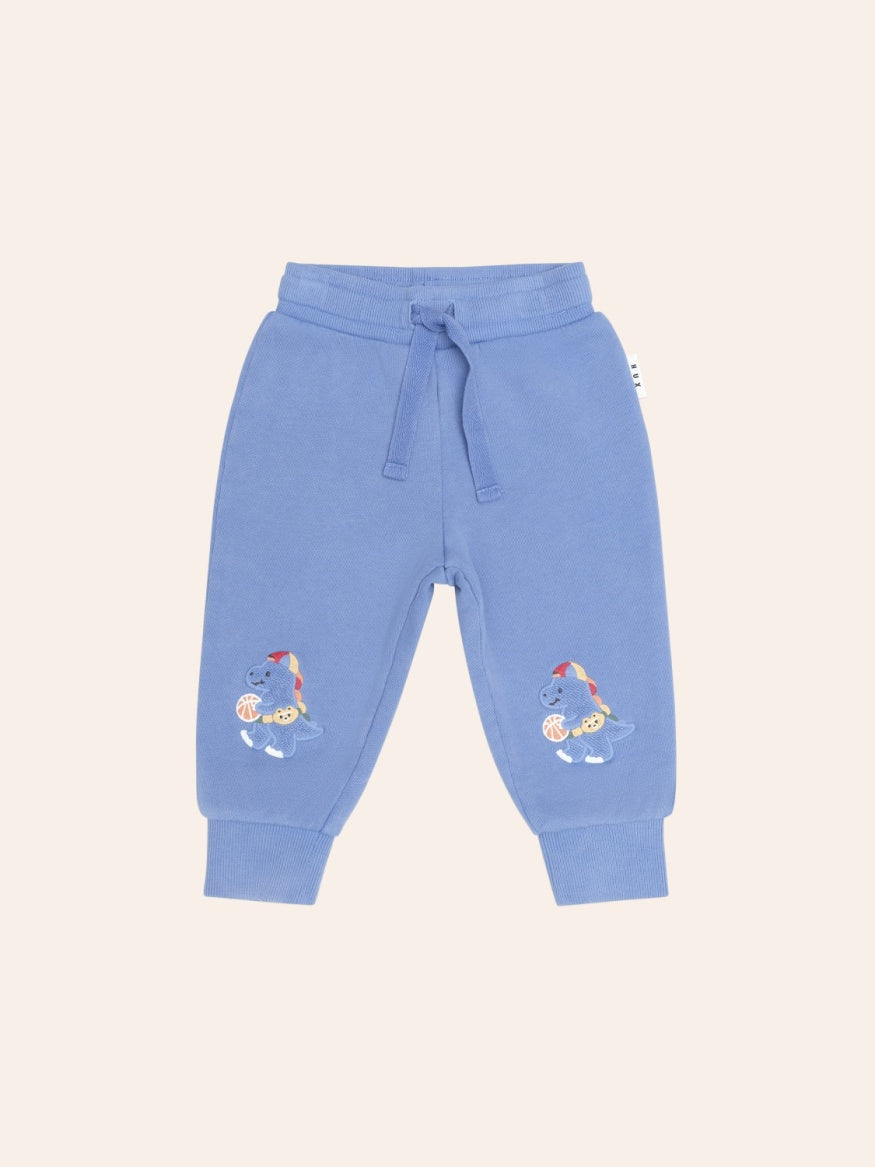 Huxbaby Baller Dino Sporty Stripe Sweatpants in  blue with colourful dinosaur print, striped side panels, and a comfortable elastic waistband.