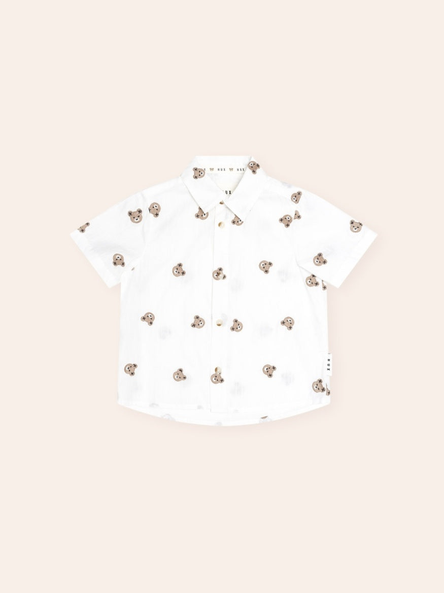 Huxbaby All Over Hux Emb Short Sleeve Shirt featuring an all-over Hux embroidery pattern, classic button-up design, short sleeves, and lightweight fabric for smart casual kids' wear.