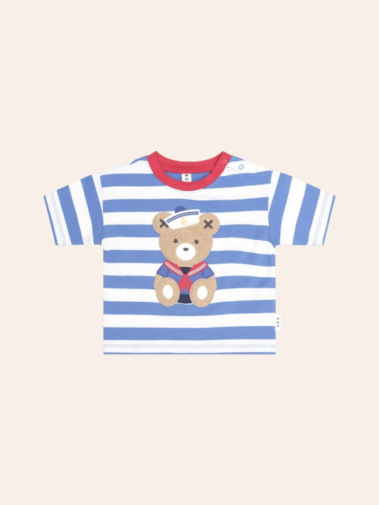 Child's short-sleeve T-shirt with navy and white nautical stripes. A small embroidered Huxbear sits on the left chest, wearing a sailor-style outfit. The tee has a classic crew neckline and a relaxed fit, giving it a timeless, casual look.