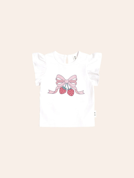 Soft pink short-sleeve T-shirt with delicate frill sleeves and a crew neckline. The front features a sweet strawberry graphic accented with a bow, creating a playful, whimsical look. The relaxed fit makes it ideal for everyday wear.
