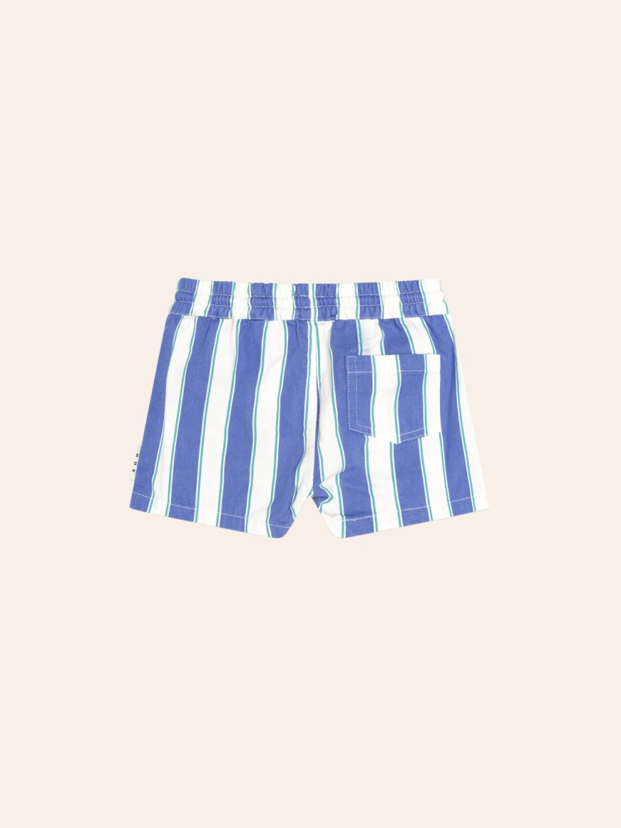 Kids Huxbaby Tropical Stripe Drawcord Shorts featuring a bold tropical stripe pattern, relaxed fit, adjustable drawcord waistband, and lightweight summer design.