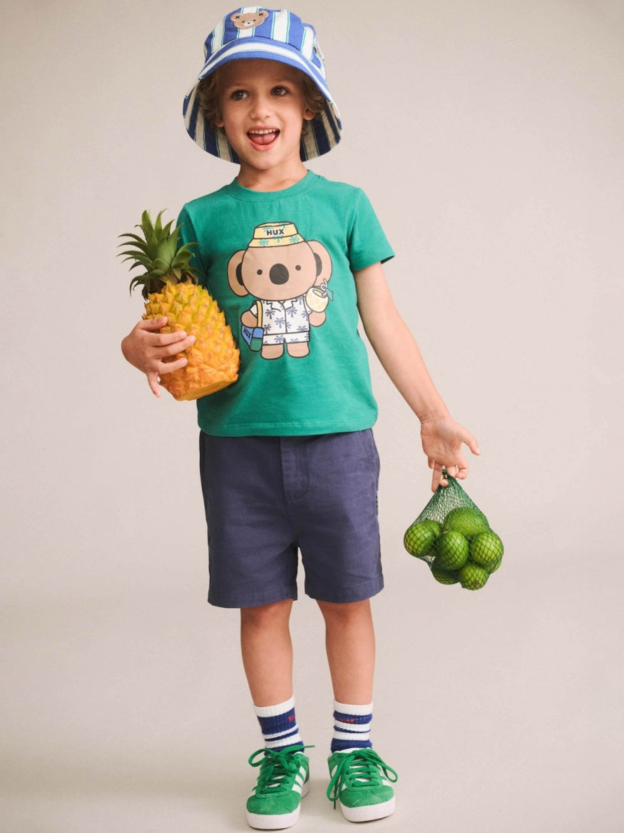 Huxbaby Vacay Kel Tee featuring a soft relaxed fit, lightweight fabric, and casual kids’ t-shirt design for everyday comfort.
