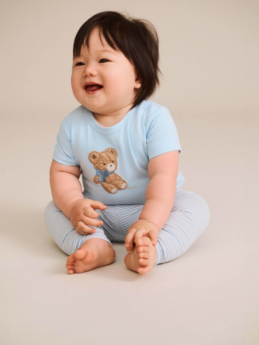 Cute Huxbaby Bow Hux Short Sleeve Bodysuit featuring a cute Huxbear bow detail, soft fabric and comfortable fit for babies and toddlers.
