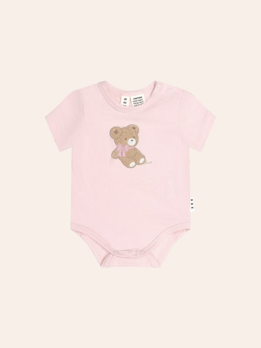 Huxbaby Bow Huxette Short Sleeve Bodysuit in soft baby fabric with cute bow detail, designed for comfortable everyday wear.