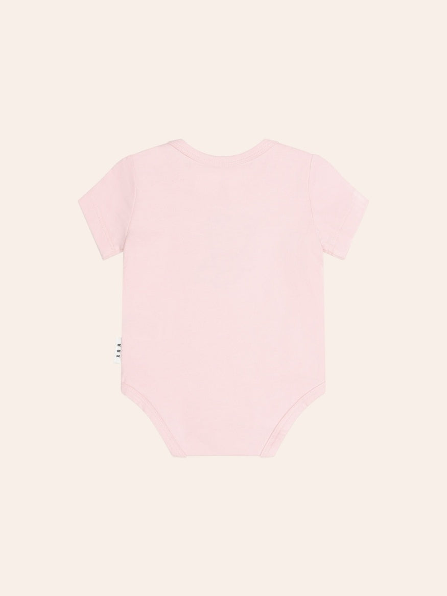 Back view Huxbaby Bow Huxette Short Sleeve Bodysuit in soft baby fabric with cute bow detail, designed for comfortable everyday wear.