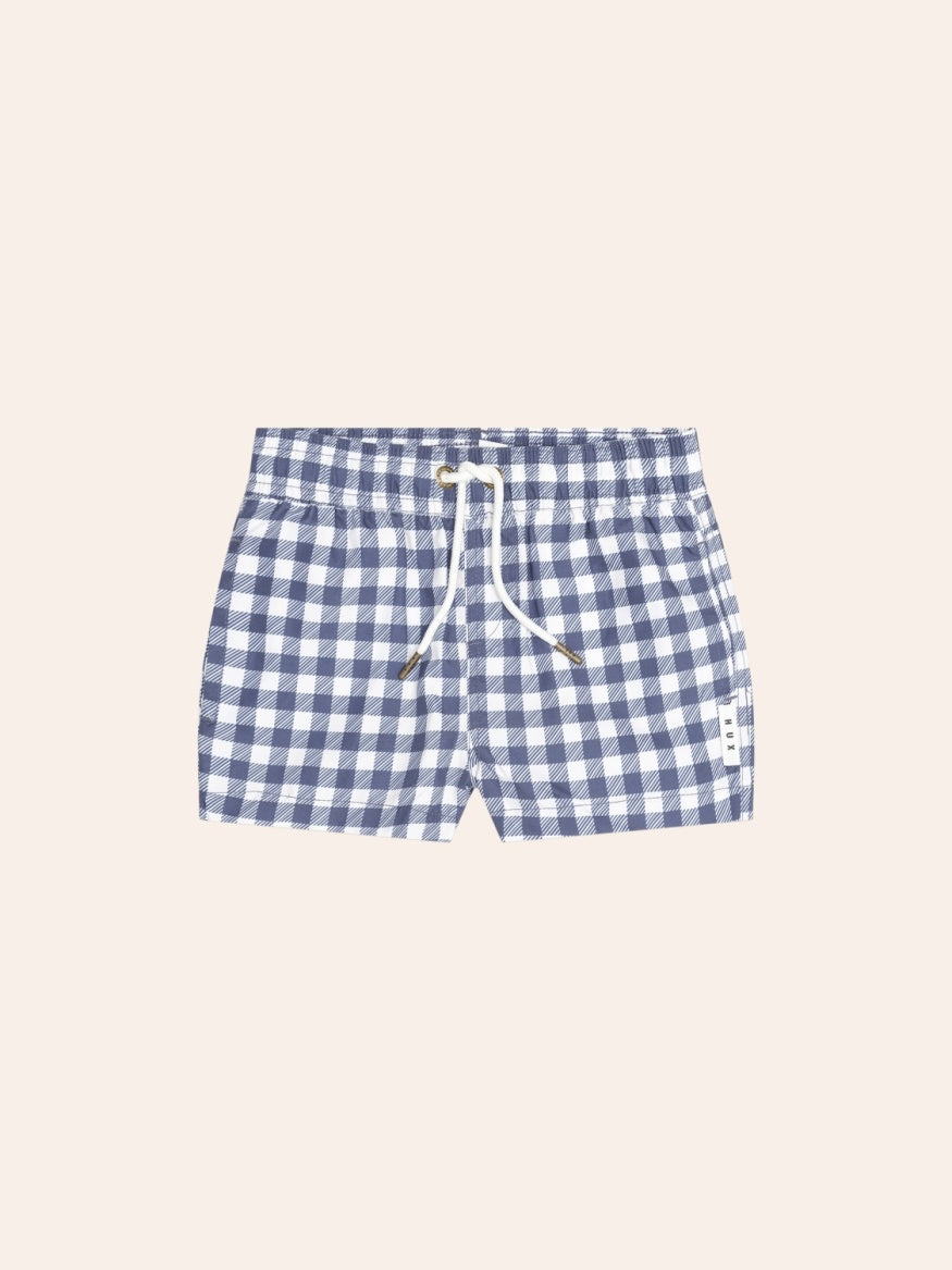 Huxbaby Ink Gingham Boardshorts featuring a classic gingham pattern, lightweight quick-drying fabric, and comfortable kids’ swimwear design.