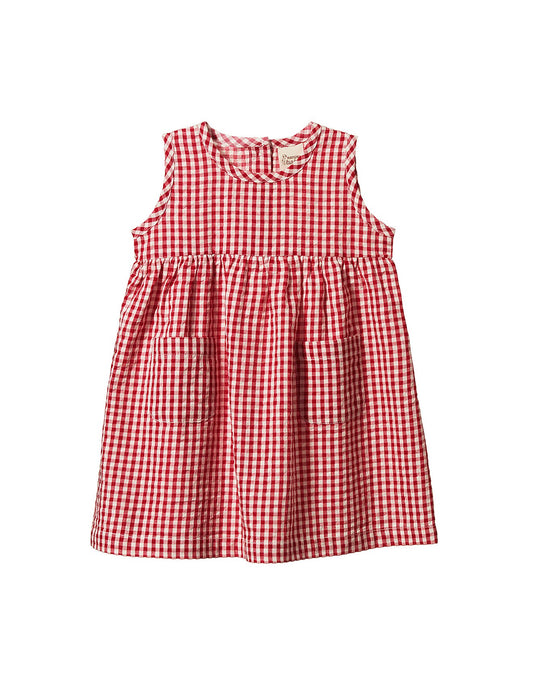 Nature Baby Dorothy Dress in red gingham, a lightweight organic cotton baby dress with a sleeveless design, gathered waist and patch pockets.