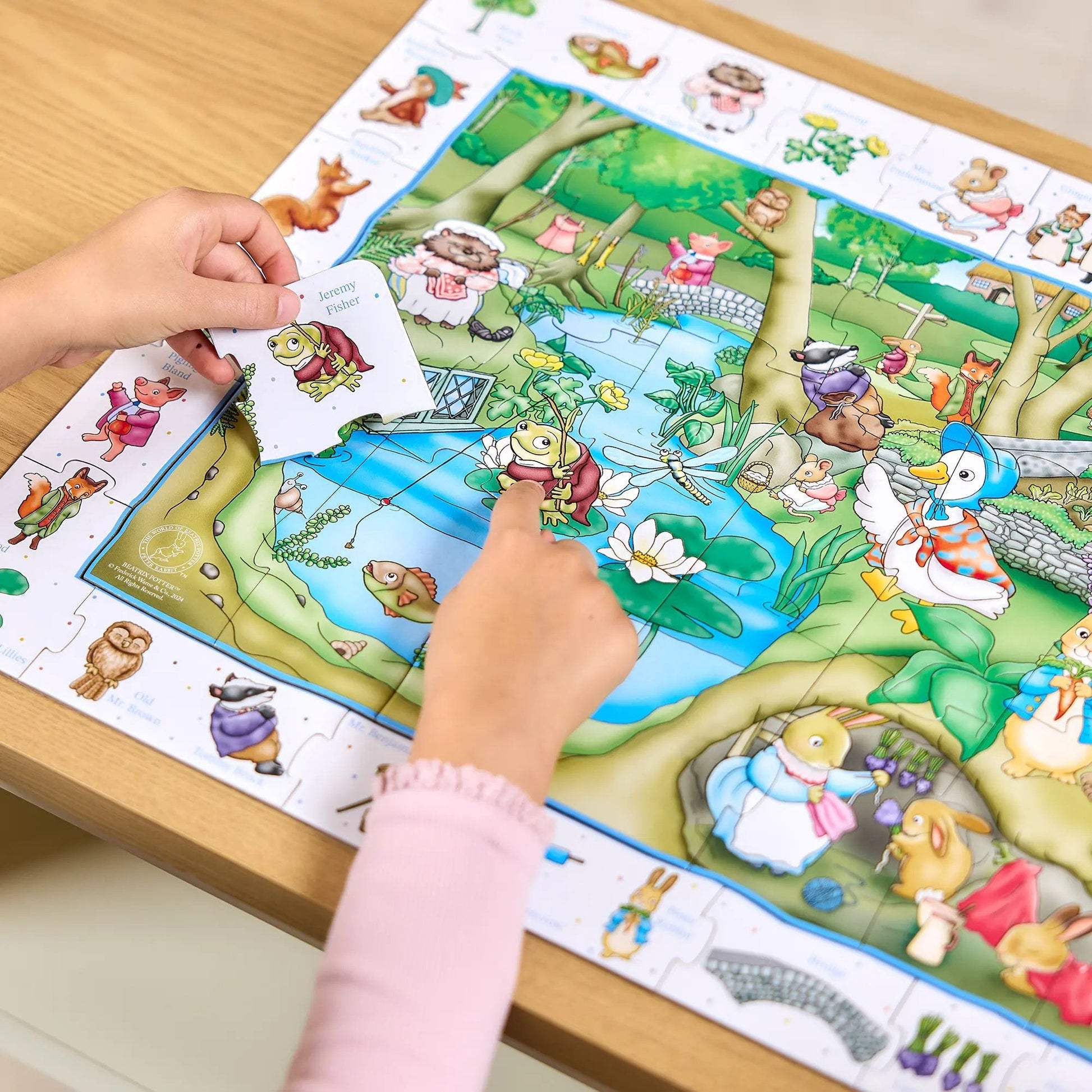 Educational Orchard Toys World of Peter Rabbit 50-piece puzzle featuring Peter Rabbit and woodland friends in a colourful garden setting.